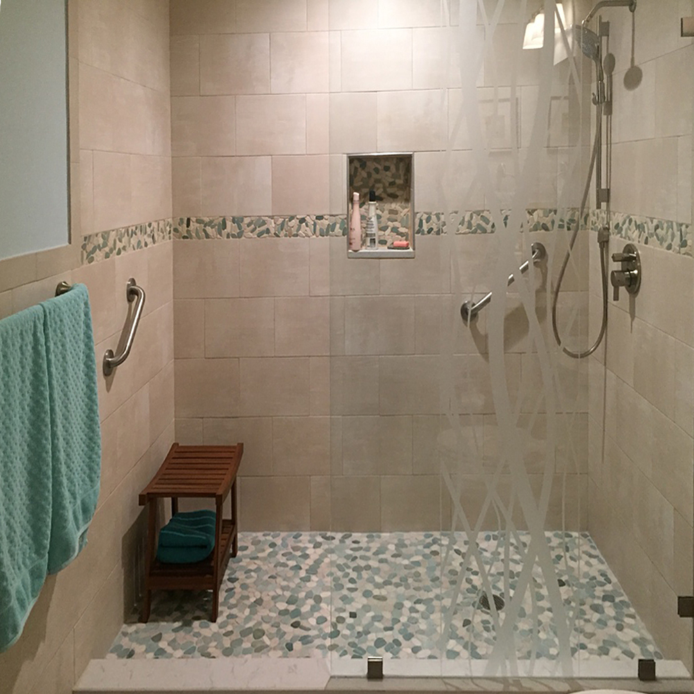 Sliced Green and White Pebble Tile Shower Floor and Border Strip