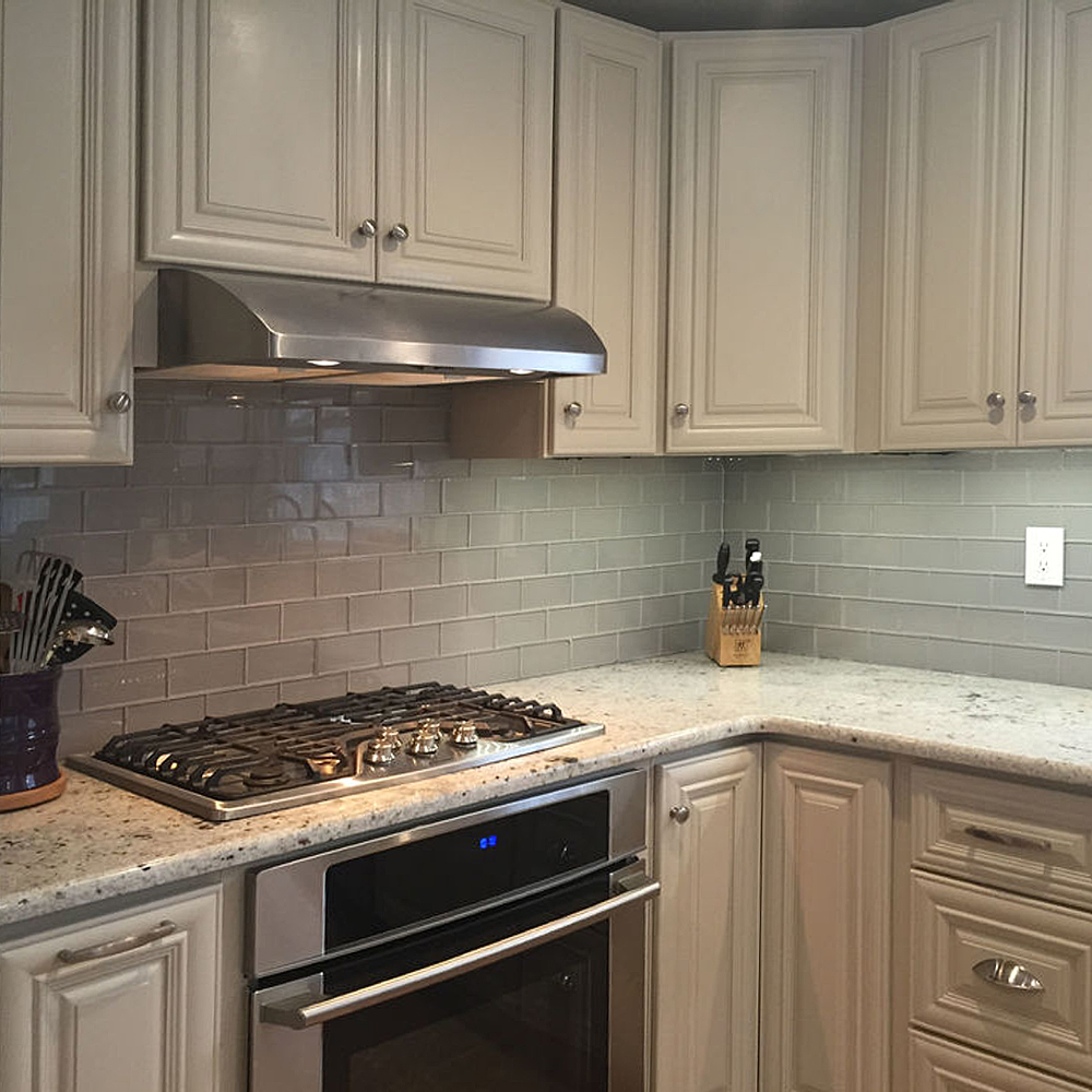 Grey Glass Subway Tile Kitchen Backsplash with White Cabinets