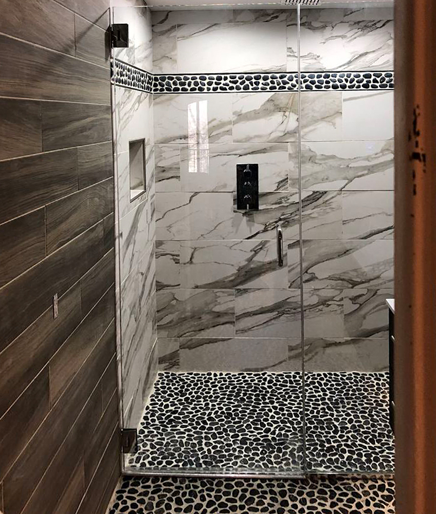 Polished Black Pebble Tile Shower