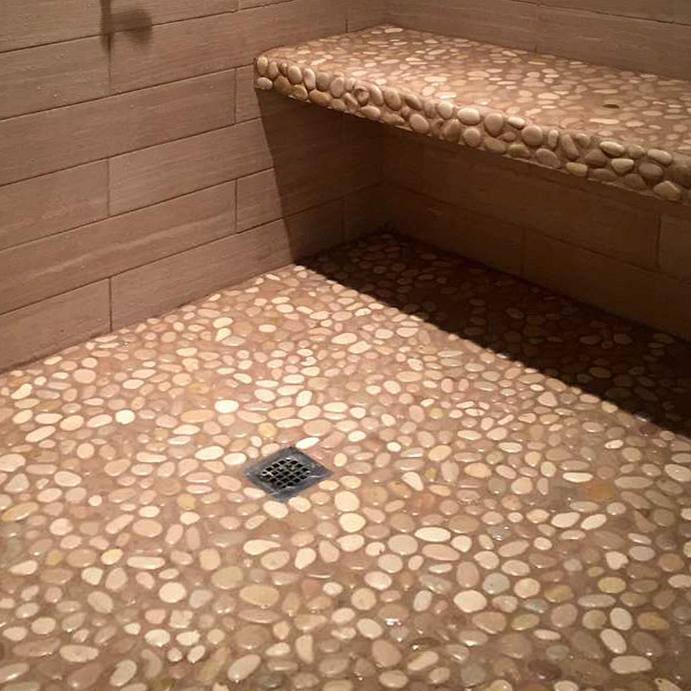Glazed Tan Pebble Tile Shower Floor and Bench