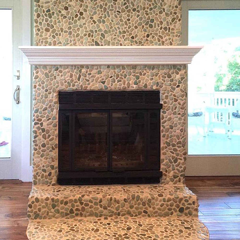 sea green pebble tile fireplace surround and hearth