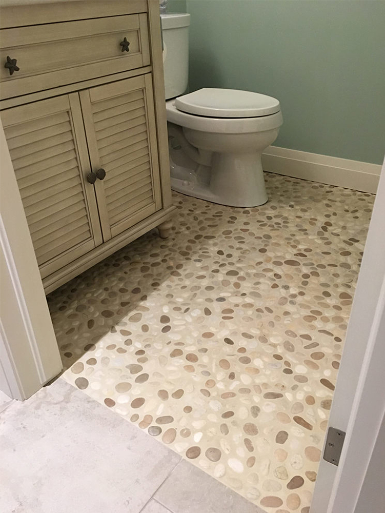 java-tan-and-white-pebble-nathroom-flooring