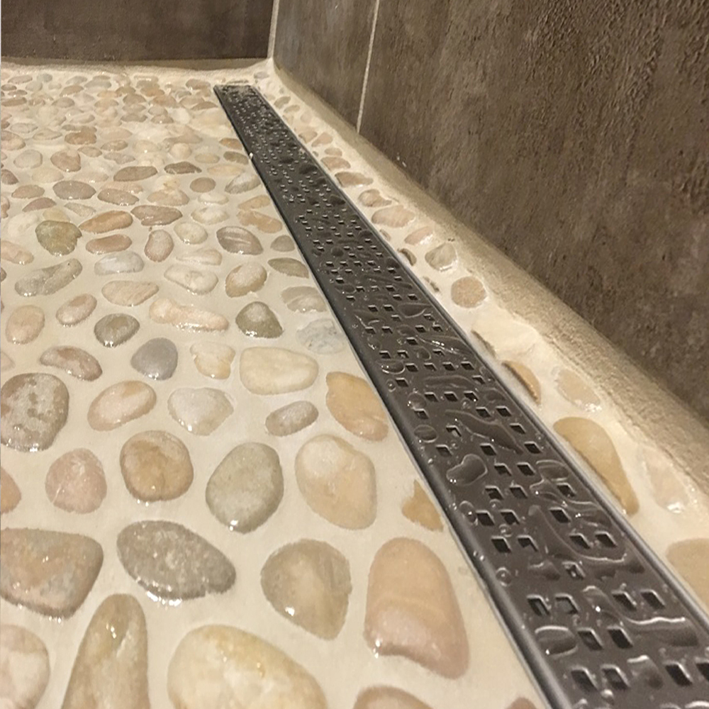 Java Tan Pebble Tile Shower with Modern Grate Drain
