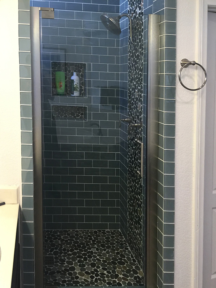 sliced-bali-ocean-pebble-tile-shower-floor-walls-and-accent-with-ocean-glass-subway-tile