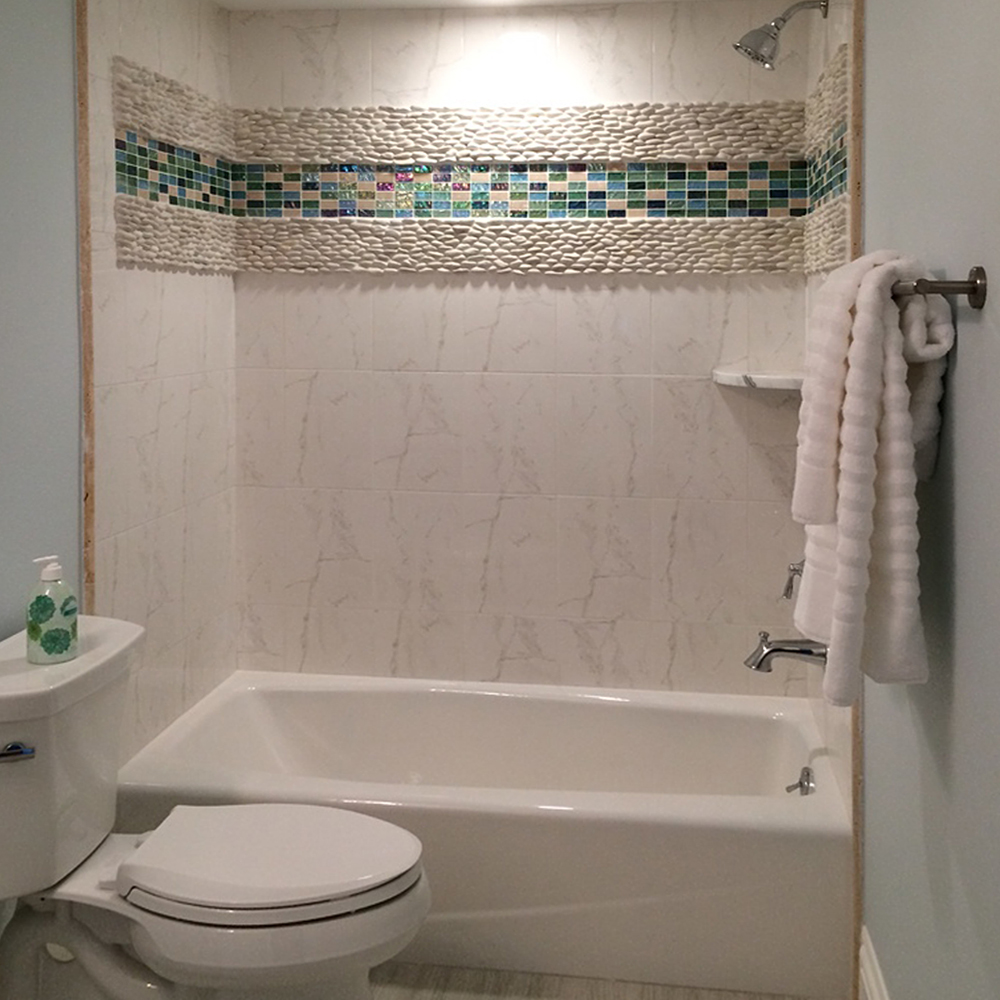 Standing White Pebble Tile Shower Accent