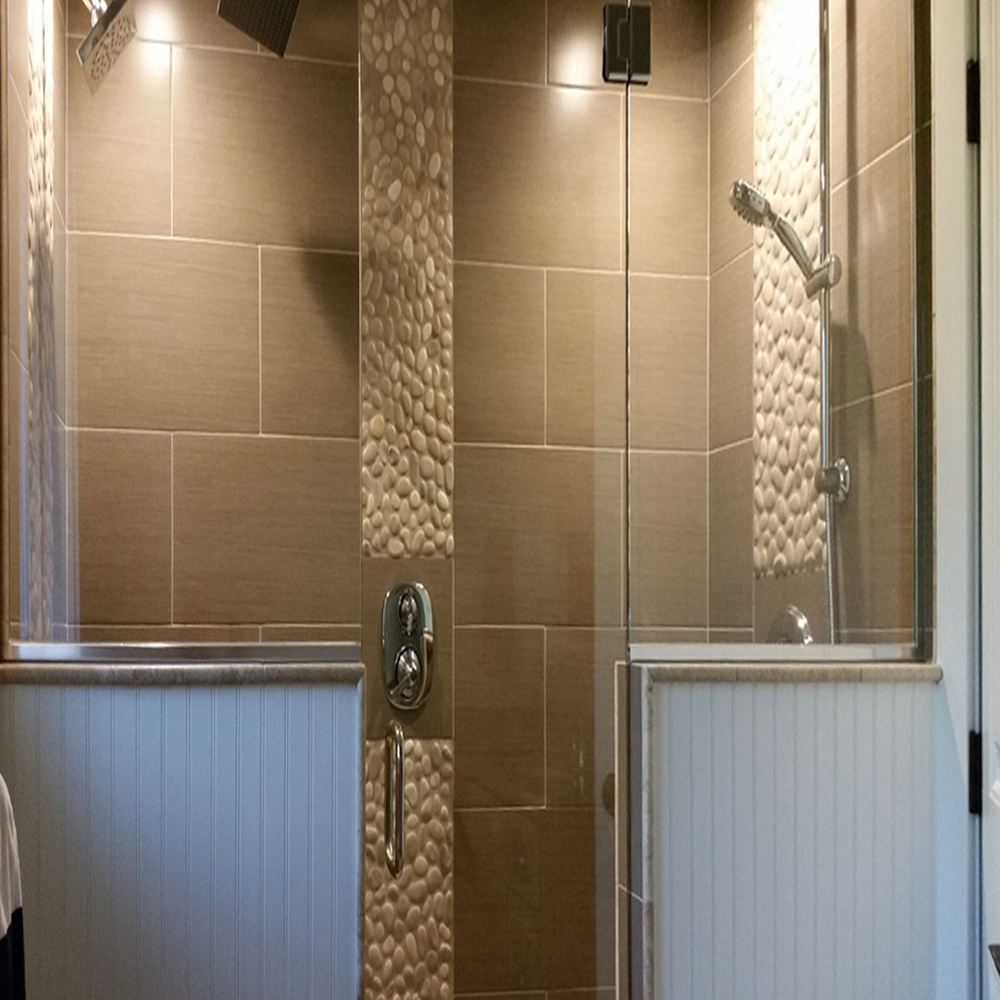 tan-pebble-tile-shower-floor-and-accents
