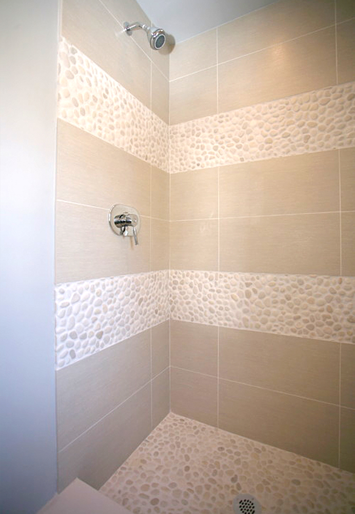white-pebble-tile-shower-pan-and-border-strips